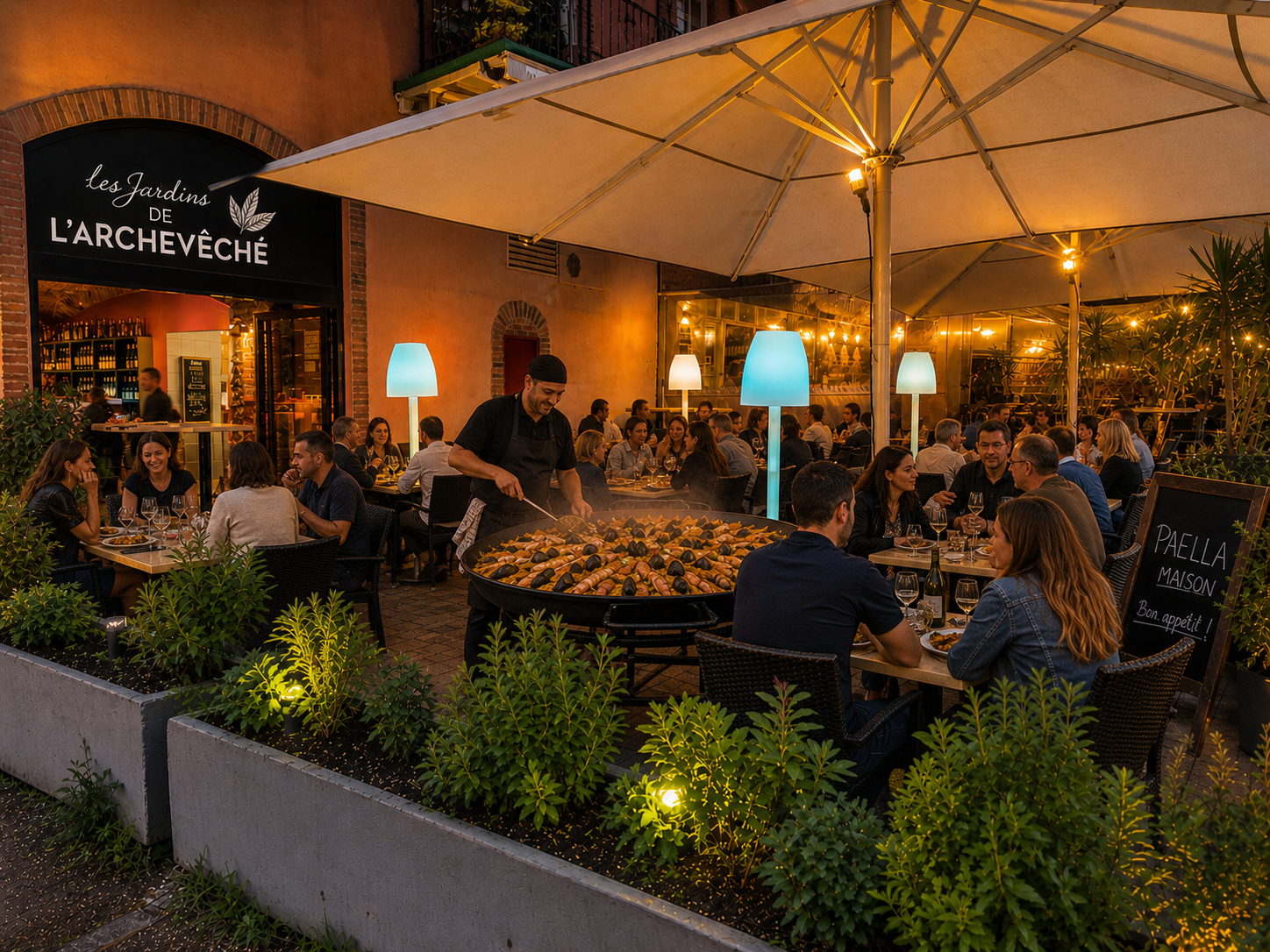 Exemple de soirée de groupe autour d'une paella géante en terrasse aux Jardins de l'Archevêché à Albi